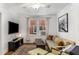 Comfortable living room featuring hardwood floors, natural light, and a cozy seating area at 1111 Briarcliff Ne Pl # 2, Atlanta, GA 30306