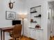 Bright office with hardwood floors, built-in shelves, and a vintage desk setup at 1111 Briarcliff Ne Pl # 2, Atlanta, GA 30306
