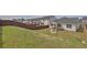 Spacious backyard with a fire pit and wood fence, perfect for entertaining at 1991 Vidalia Ct, Dacula, GA 30019