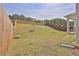 Backyard featuring a fire pit and well-maintained lawn at 1991 Vidalia Ct, Dacula, GA 30019