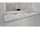 Bathroom featuring double sinks with marble countertops and modern faucets at 1991 Vidalia Ct, Dacula, GA 30019