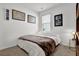 Well-lit bedroom featuring a comfortable bed and decorative wall art at 1991 Vidalia Ct, Dacula, GA 30019