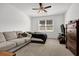 A cozy bedroom featuring a queen bed, neutral-colored walls, and ample natural light at 1991 Vidalia Ct, Dacula, GA 30019