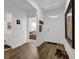 Bright entryway with hardwood floors, neutral walls, and views to the living spaces beyond at 1991 Vidalia Ct, Dacula, GA 30019