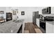 Modern kitchen with stainless steel appliances and white cabinets at 1991 Vidalia Ct, Dacula, GA 30019