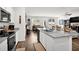 Bright open kitchen with granite counters, white cabinetry, and stainless steel appliances at 1991 Vidalia Ct, Dacula, GA 30019