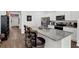 Open-concept kitchen features a large island, white cabinets, and modern stainless steel appliances at 1991 Vidalia Ct, Dacula, GA 30019