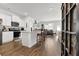 Bright kitchen with stainless steel appliances, granite countertops, a center island, and breakfast bar at 1991 Vidalia Ct, Dacula, GA 30019