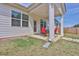 Back patio with outdoor seating, perfect for enjoying the landscaped backyard at 1991 Vidalia Ct, Dacula, GA 30019