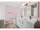 Bathroom featuring double vanity with marble countertops at 395 Shadetree Ln, Lawrenceville, GA 30044