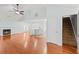 Open concept living area features hardwood floors, a fireplace, and connects to the kitchen at 395 Shadetree Ln, Lawrenceville, GA 30044