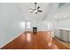 Spacious living room with vaulted ceilings, hardwood floors, and a cozy fireplace at 395 Shadetree Ln, Lawrenceville, GA 30044