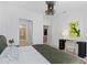 Bright bedroom featuring white walls, a modern light fixture, desk, and ensuite bathroom at 775 Juniper Ne St # 111, Atlanta, GA 30308