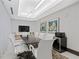 This is a well-lit conference room that includes a large dark wood conference table and a television at 775 Juniper Ne St # 111, Atlanta, GA 30308