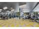 A community fitness center featuring modern exercise machines, a water rower, and mirrored walls at 775 Juniper Ne St # 111, Atlanta, GA 30308