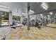 A fitness center with treadmills, elliptical machines, weights, and mirrored walls overlooking an outdoor pool at 775 Juniper Ne St # 111, Atlanta, GA 30308