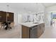 Bright kitchen featuring an island with a stainless steel dishwasher and faucet overlooking the living room at 775 Juniper Ne St # 111, Atlanta, GA 30308