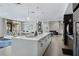 Open-concept kitchen with a large island and bar seating in a bright and inviting space at 775 Juniper Ne St # 111, Atlanta, GA 30308