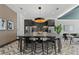 Modern kitchen with stainless steel appliances, island with seating, and stylish pendant lighting at 775 Juniper Ne St # 111, Atlanta, GA 30308