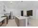 Modern kitchen with white cabinets, stainless steel appliances, and a spacious island for meal preparation at 775 Juniper Ne St # 111, Atlanta, GA 30308