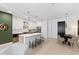 Modern kitchen with a large center island, stainless steel appliances, and adjacent dining area for easy entertaining at 775 Juniper Ne St # 111, Atlanta, GA 30308