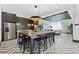 A well-equipped kitchen and gathering space featuring a large island, stainless steel appliances, and sleek finishes at 775 Juniper Ne St # 111, Atlanta, GA 30308