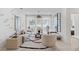 Comfortable living room features a stylish rug, contemporary decor, and bright natural light from large windows at 775 Juniper Ne St # 111, Atlanta, GA 30308