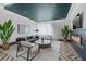 Inviting living room with a fireplace, modern decor, neutral palette, and lots of natural light at 775 Juniper Ne St # 111, Atlanta, GA 30308