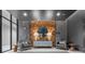 Lobby with two lounge chairs, decorative wooden wall, and mirrors at 775 Juniper Ne St # 111, Atlanta, GA 30308