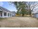 Expansive backyard with lawn, mature trees, privacy fence, and a cozy sunroom at 1099 Wynford Cmns, Marietta, GA 30064