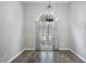 Elegant living room with hardwood floors, neutral paint, and a large window for natural light at 1099 Wynford Cmns, Marietta, GA 30064