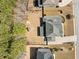 Birds-eye view of backyard with play set, landscaped yard, and mature trees at 1439 Mill Pointe Ct, Lawrenceville, GA 30043