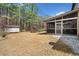 Backyard featuring a screened porch, shed, and playset, all set within a spacious lawn at 1439 Mill Pointe Ct, Lawrenceville, GA 30043