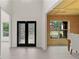 Elegant foyer with decorative glass double doors and views into the dining room and front living room at 1439 Mill Pointe Ct, Lawrenceville, GA 30043