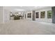 Spacious living area with an open floor plan, large windows, and recessed lighting at 1439 Mill Pointe Ct, Lawrenceville, GA 30043