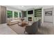 Inviting living room with custom built-ins, fireplace, and natural light at 1439 Mill Pointe Ct, Lawrenceville, GA 30043
