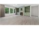Bright living room featuring custom built-ins, a cozy fireplace, and lots of natural light at 1439 Mill Pointe Ct, Lawrenceville, GA 30043