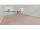 Open loft area with carpet, railing and lots of natural light at 1439 Mill Pointe Ct, Lawrenceville, GA 30043