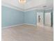Bright main bedroom boasts tray ceilings, neutral walls, and hardwood floors at 1439 Mill Pointe Ct, Lawrenceville, GA 30043