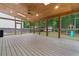Large screened porch with a wooden floor, ceiling fan, and view of the backyard at 1439 Mill Pointe Ct, Lawrenceville, GA 30043