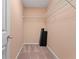 A walk-in closet equipped with shelving offers efficient storage solutions at 1439 Mill Pointe Ct, Lawrenceville, GA 30043