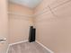 A walk-in closet equipped with shelving offers efficient storage solutions at 1439 Mill Pointe Ct, Lawrenceville, GA 30043