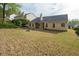 Nice backyard with a firepit and good landscaping at 1851 Millwood Park Ct, Buford, GA 30518