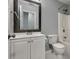 Bathroom featuring a sink, toilet, vanity, and a bathtub with shower at 1851 Millwood Park Ct, Buford, GA 30518
