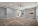 Large carpeted bedroom with a ceiling fan and access to the bathroom at 1851 Millwood Park Ct, Buford, GA 30518