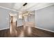 Spacious dining area with hardwood floors and view into kitchen at 1851 Millwood Park Ct, Buford, GA 30518