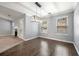Open-concept dining area with wood floors and a fireplace nearby at 1851 Millwood Park Ct, Buford, GA 30518