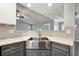 Modern kitchen sink with stainless steel features and stylish gray cabinets at 1851 Millwood Park Ct, Buford, GA 30518