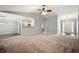 Open-concept living space showcasing a fireplace, kitchen view, and entry foyer at 1851 Millwood Park Ct, Buford, GA 30518