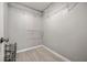 Spacious walk-in closet featuring shelving and wood-look floors; great storage at 1851 Millwood Park Ct, Buford, GA 30518